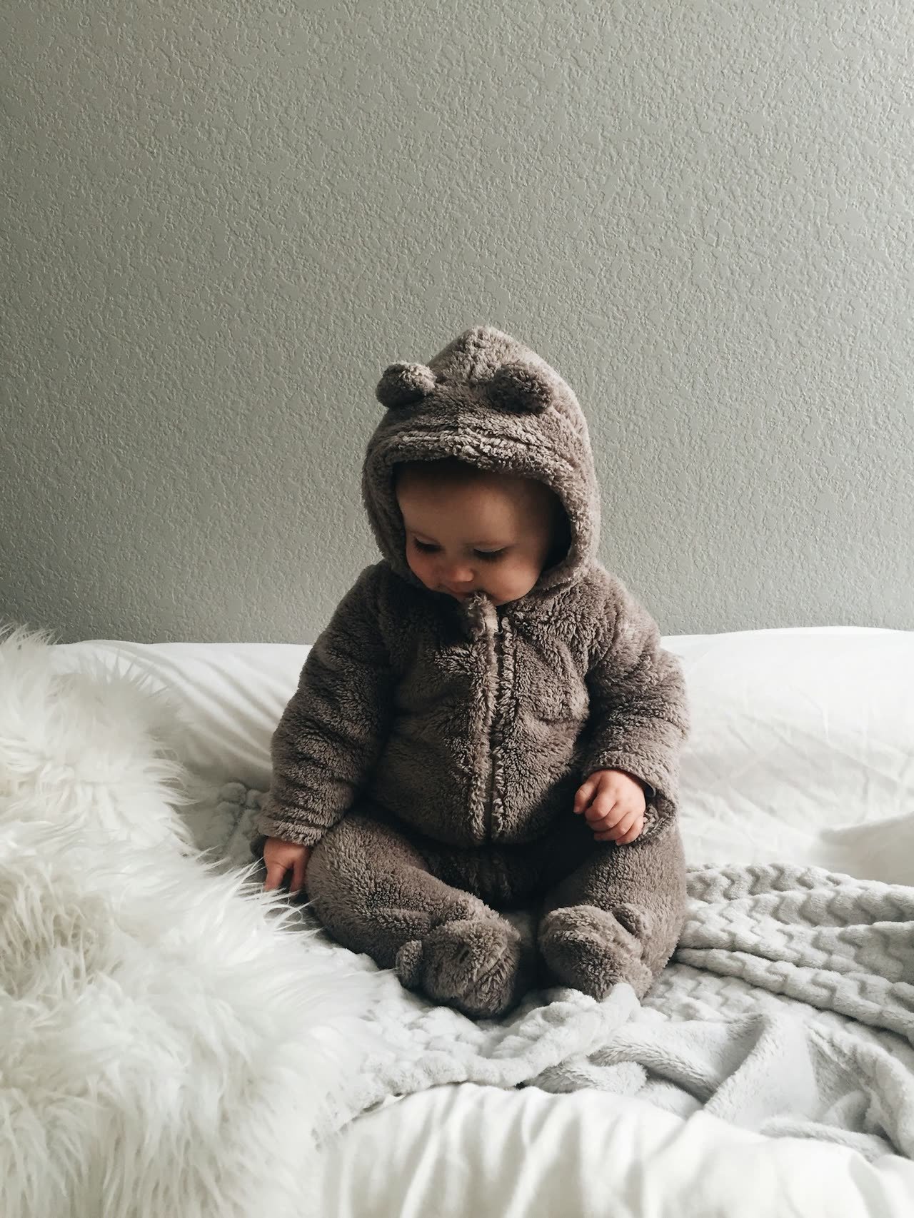 Infant in a knitted suit