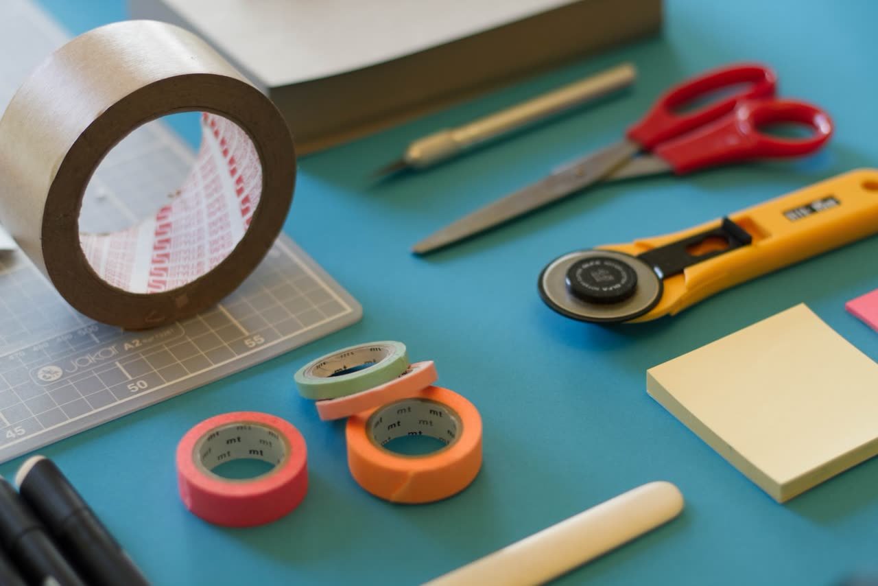 Craft tools laid out on a cutting mat