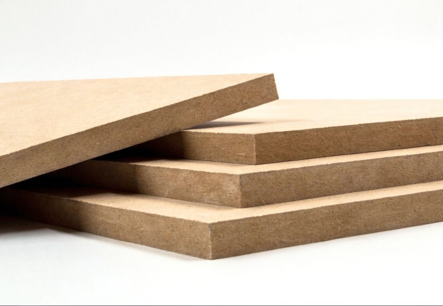 Stacked MDF boards showing their cut edges