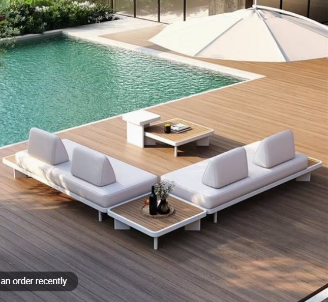 Modular outdoor seating beside a pool